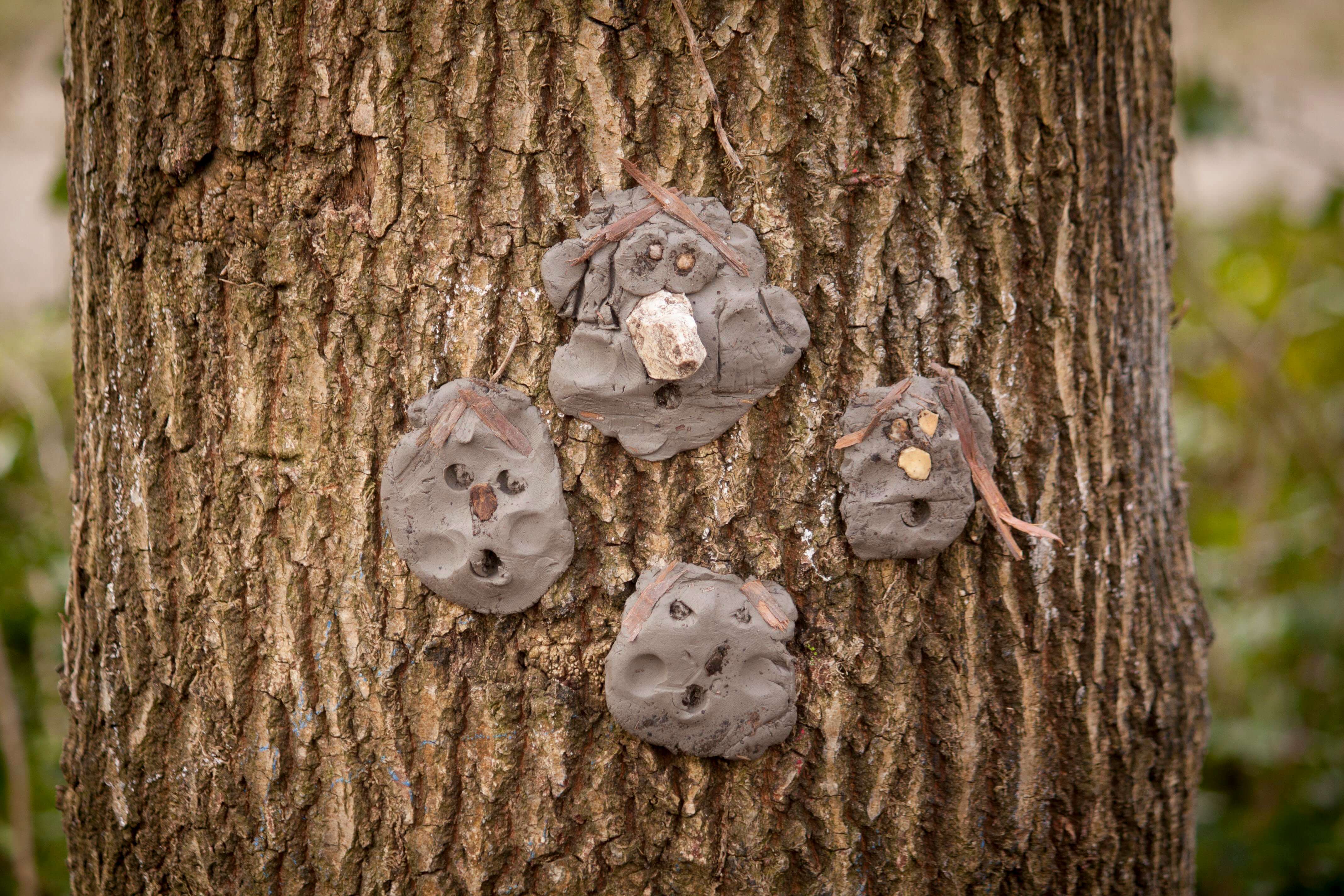 image of tree with kids clay figures attached